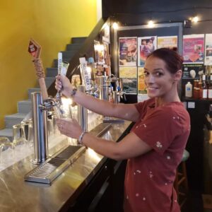 bartender Aaron pulling a drink from the kombucha tap